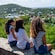 3 women sitting on a ledge overlooking Saint John, United States Virgin Islands